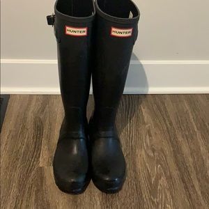 Tall black hunter boots